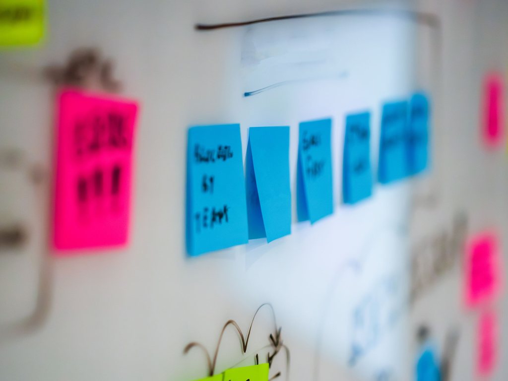 Planning notes arranged across a wall